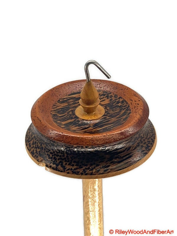 Top Whorl Drop Spindle - African Mahogany, Black Palm, Maple - 29g on white background