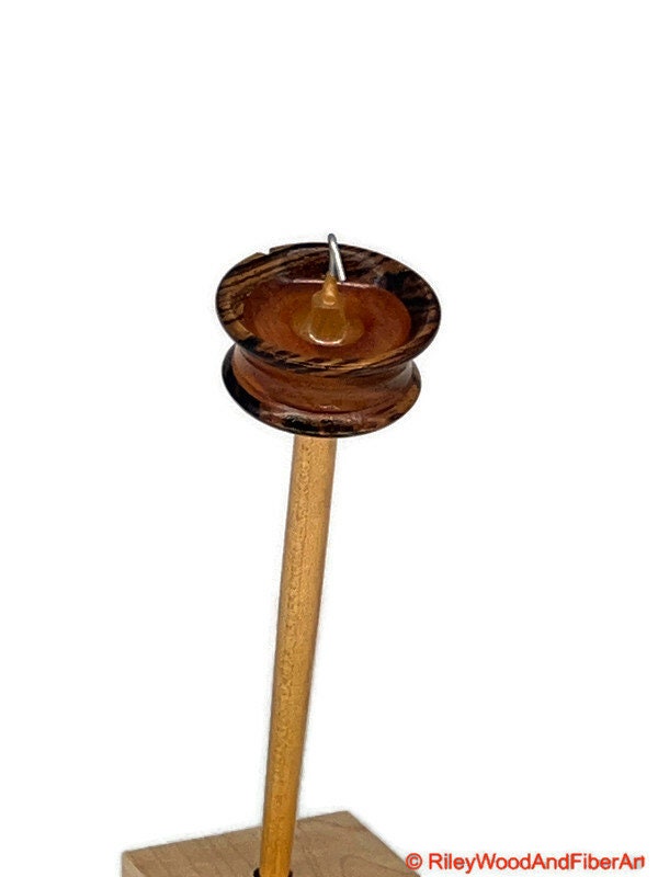 Top Whorl Drop Spindle - Zebra, Mahogany & Maple - 21g on white background