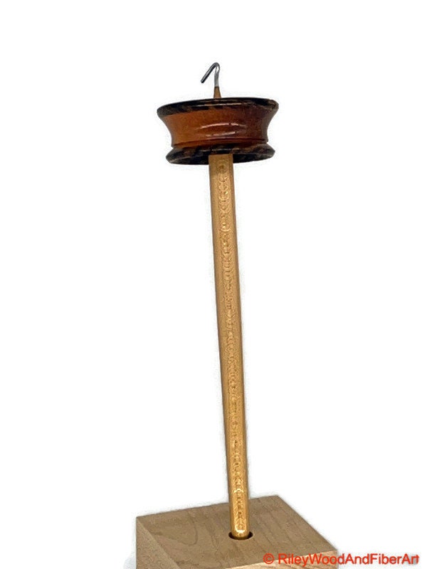Top Whorl Drop Spindle - Zebra, Mahogany & Maple - 21g on white background