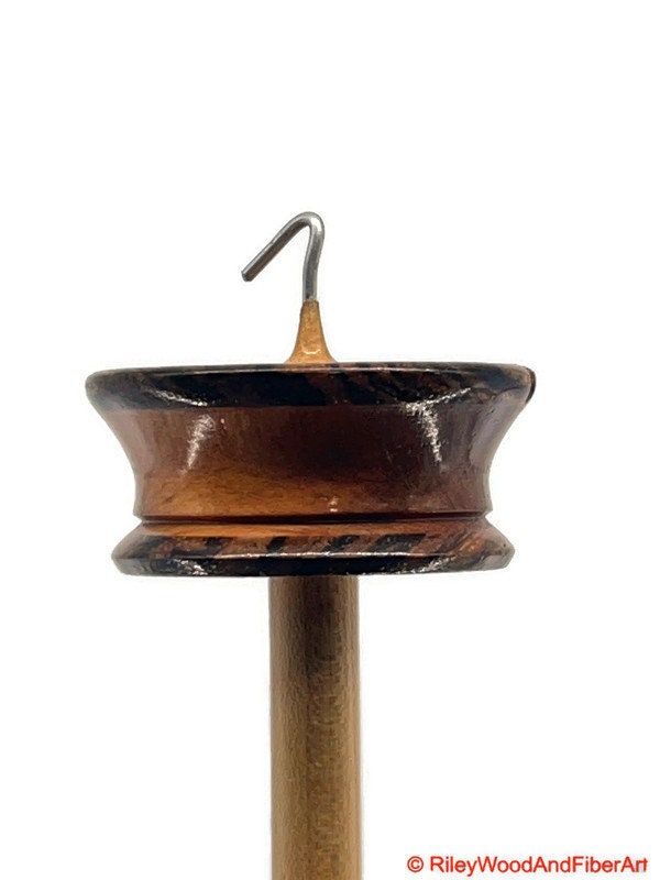 Top Whorl Drop Spindle - Zebra, Mahogany & Maple - 21g on white background