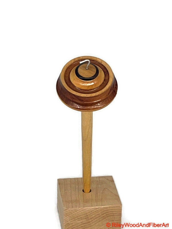 Top Whorl Drop Spindle - Walnut, Maple & Allo - 33g on white background