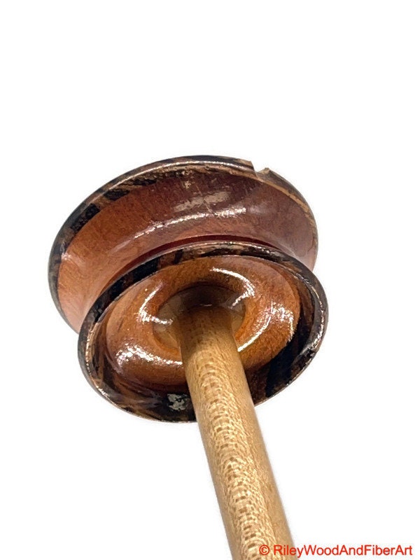 Top Whorl Drop Spindle - Zebra, Mahogany & Maple - 21g on white background