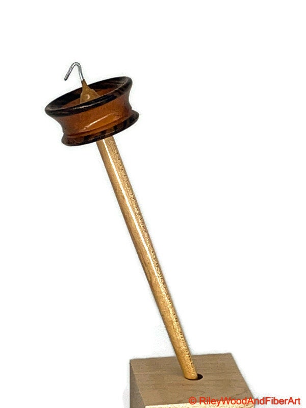 Top Whorl Drop Spindle - Zebra, Mahogany & Maple - 21g on white background