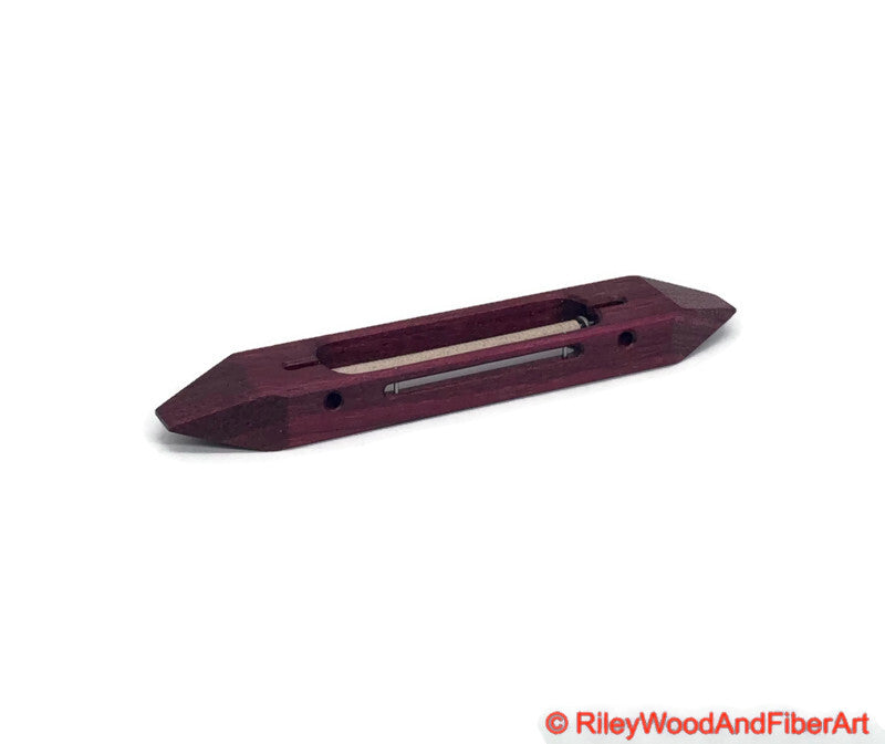 8 inch Purple Heart open bottom boat shuttle with a white background