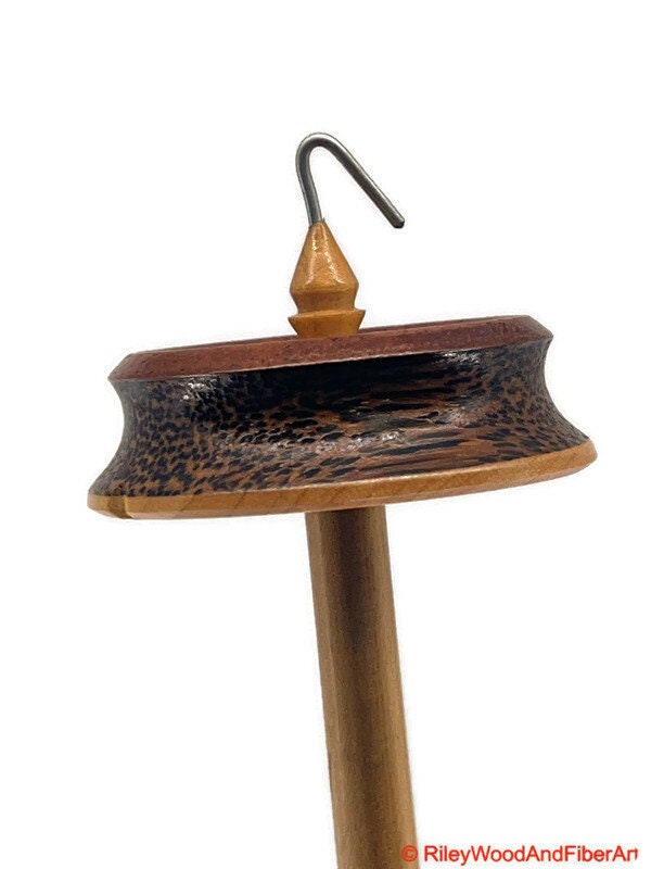 Top Whorl Drop Spindle - African Mahogany, Black Palm, Maple - 29g on white background