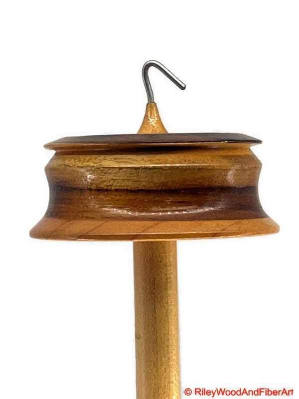 Top Whorl Drop Spindle - Walnut, Maple & Teak - 39g on white background