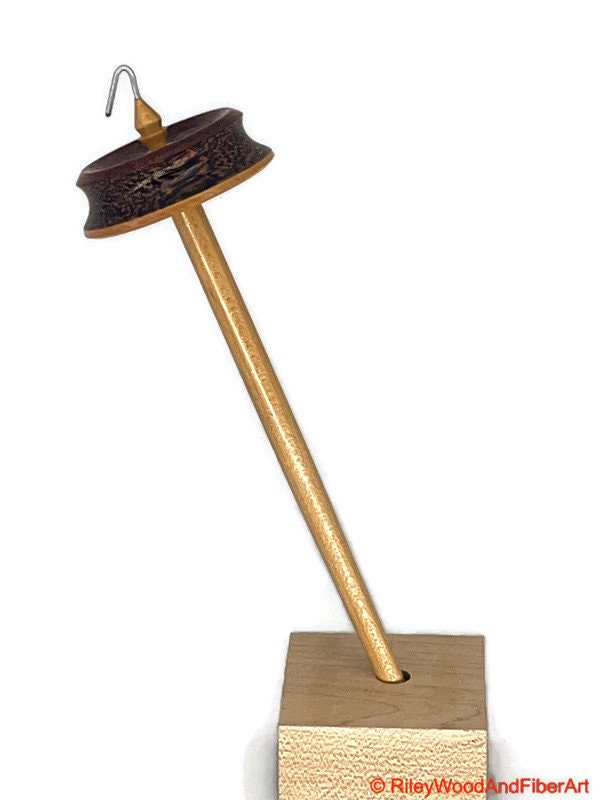 Top Whorl Drop Spindle - African Mahogany, Black Palm, Maple - 29g on white background