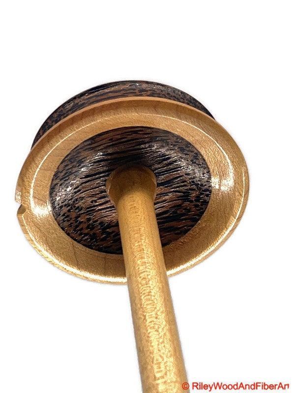 Top Whorl Drop Spindle - African Mahogany, Black Palm, Maple - 29g on white background