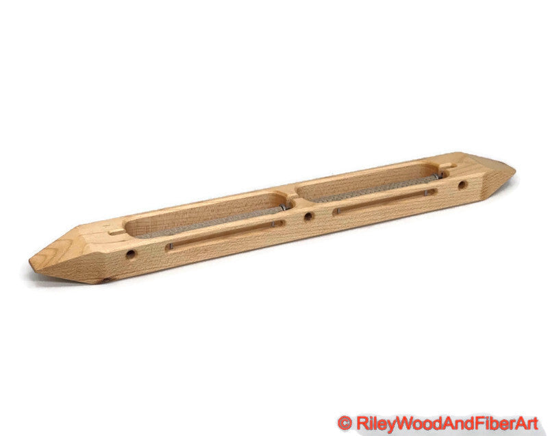 Maple closed bottom double bobbin boat shuttle on a white background