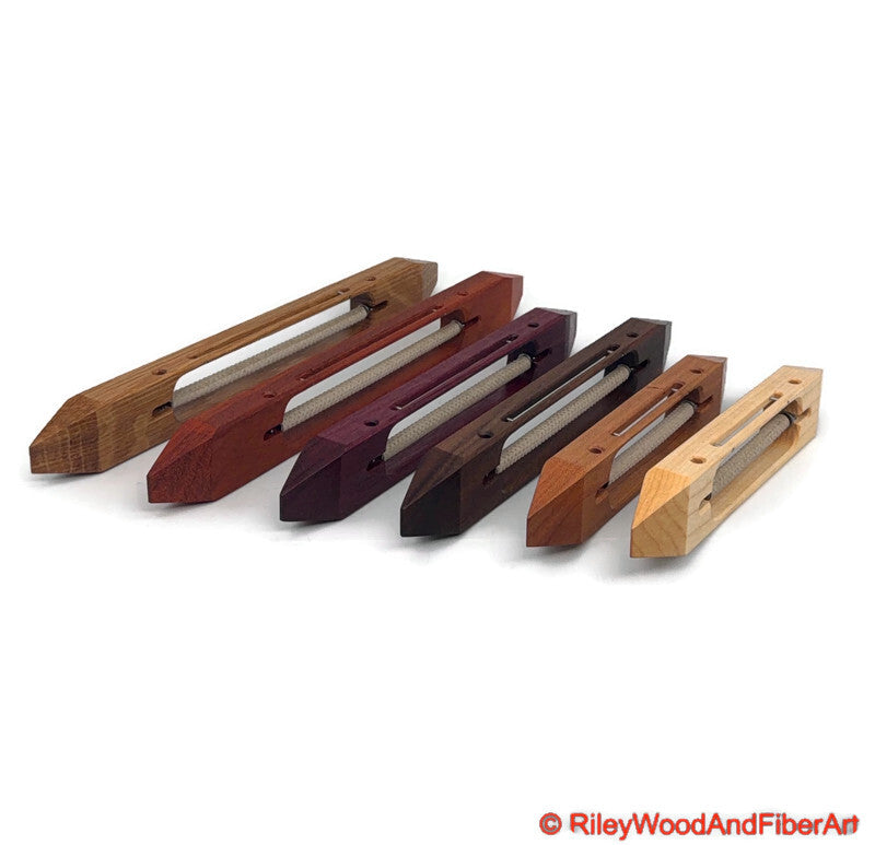 an array of open bottom boat shuttles sitting on their side on white background