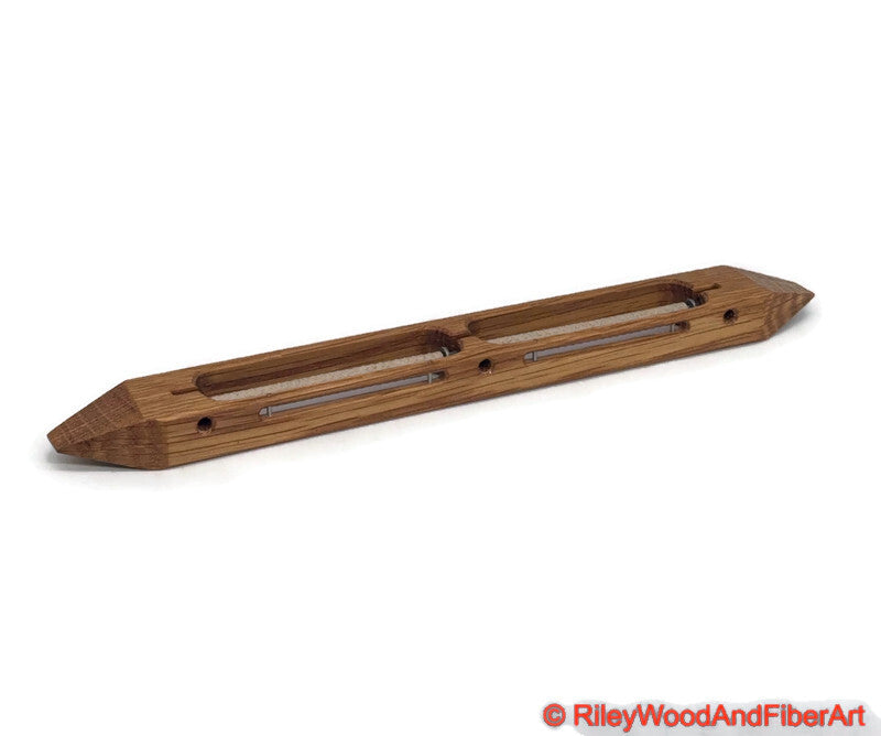 Quartersawn White Oak open bottom double bobbin boat shuttle on a white background