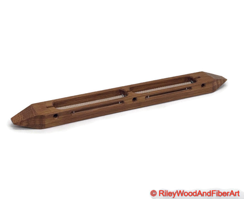 Quartersawn White Oak closed bottom double bobbin boat shuttle on a white background